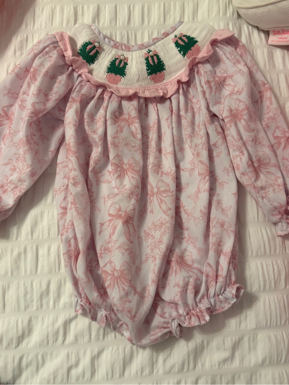 The Smocked Flamingo Pink Bow Topiary Print Smocked Baby Bubble with Pearls